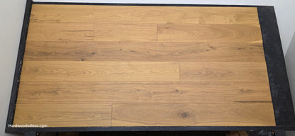 7 1/2" x 9/16" Engineered European Oak Rathlin Hardwood Flooring shown on a black shooting rack. Shot from center.