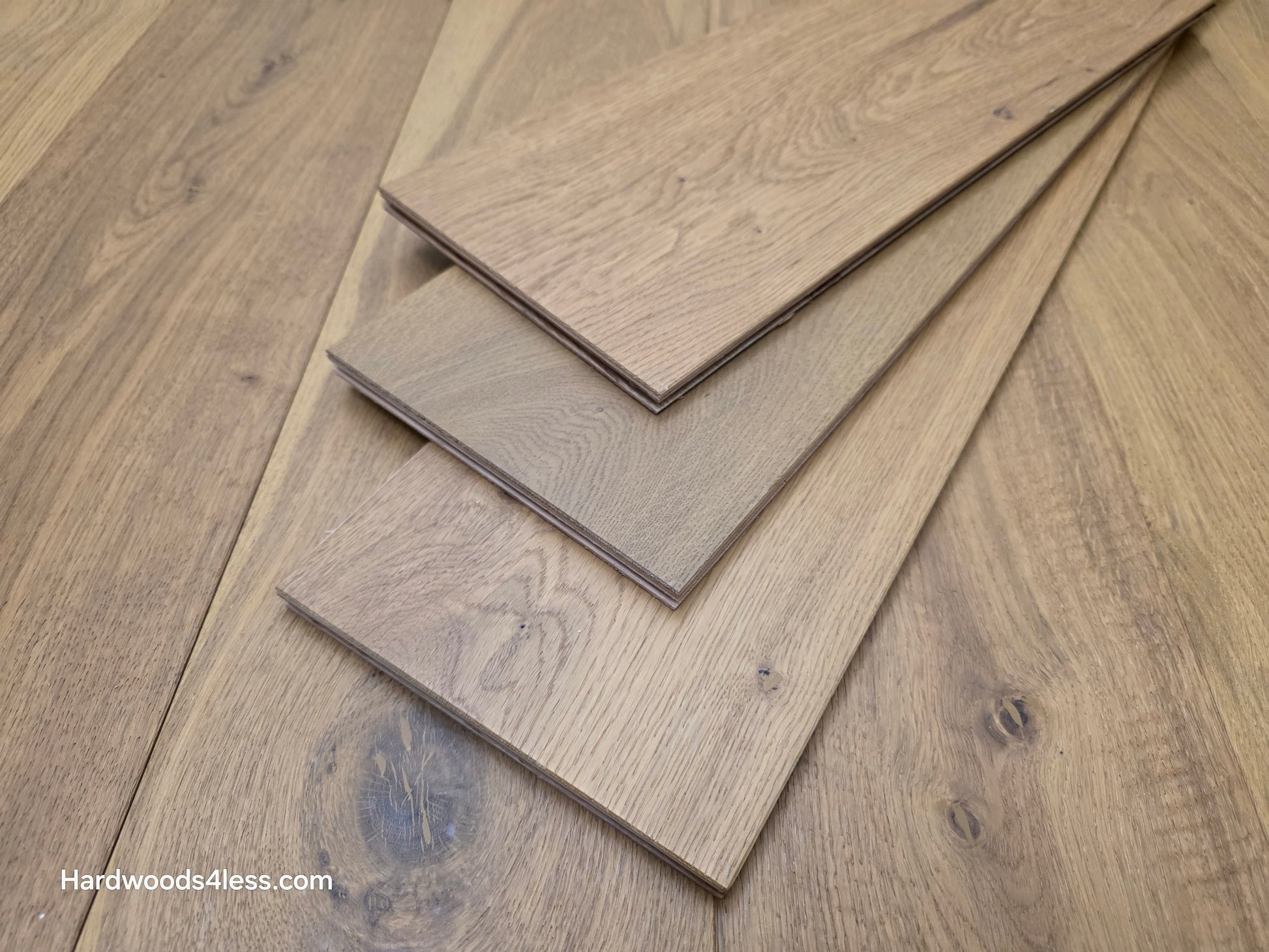 7 1/2" x 9/16" Engineered European Oak Rathlin Hardwood Flooring close up of three boards stacked on the floor.