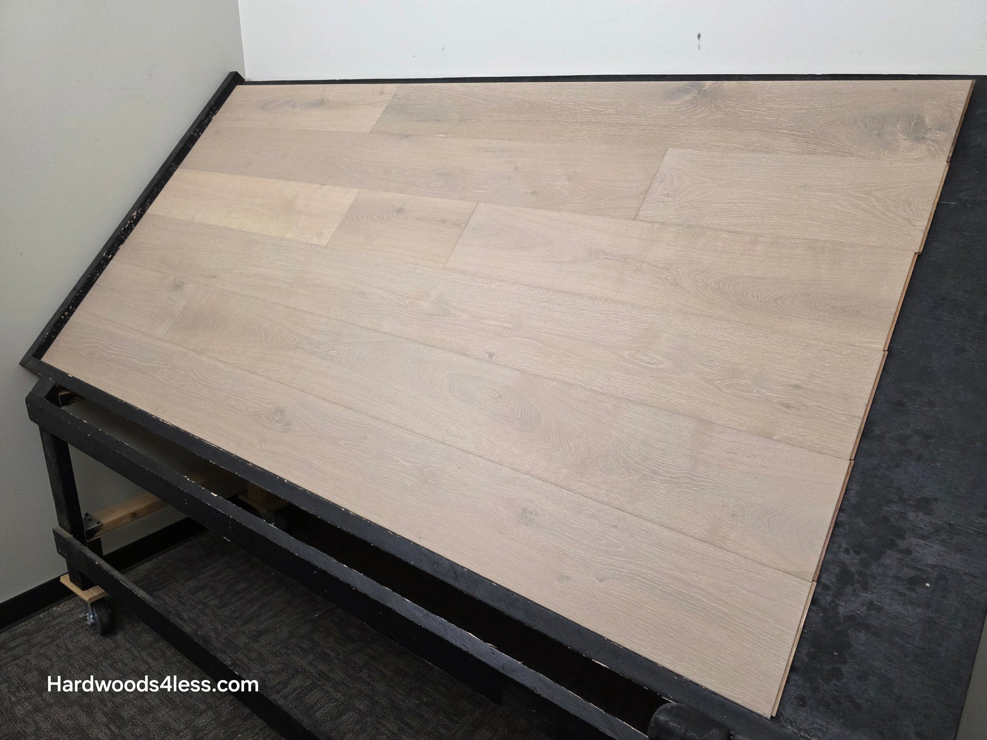 7 1/2" x 9/16" Engineered European Oak Sark Hardwood Flooring shown on a black shooting table. Shot from the right side.