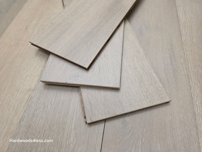 7 1/2" x 9/16" Engineered European Oak Sark Hardwood Flooring shown with three planks stacked in the center of the floor. 