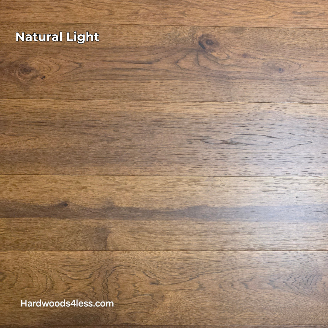 Close-up of 7 1/2" x 9/16" Engineered Hickory Alabay Hardwood Flooring with a visible brand name 'Hardwoods4less.com'.
Shown in Natural lighting.