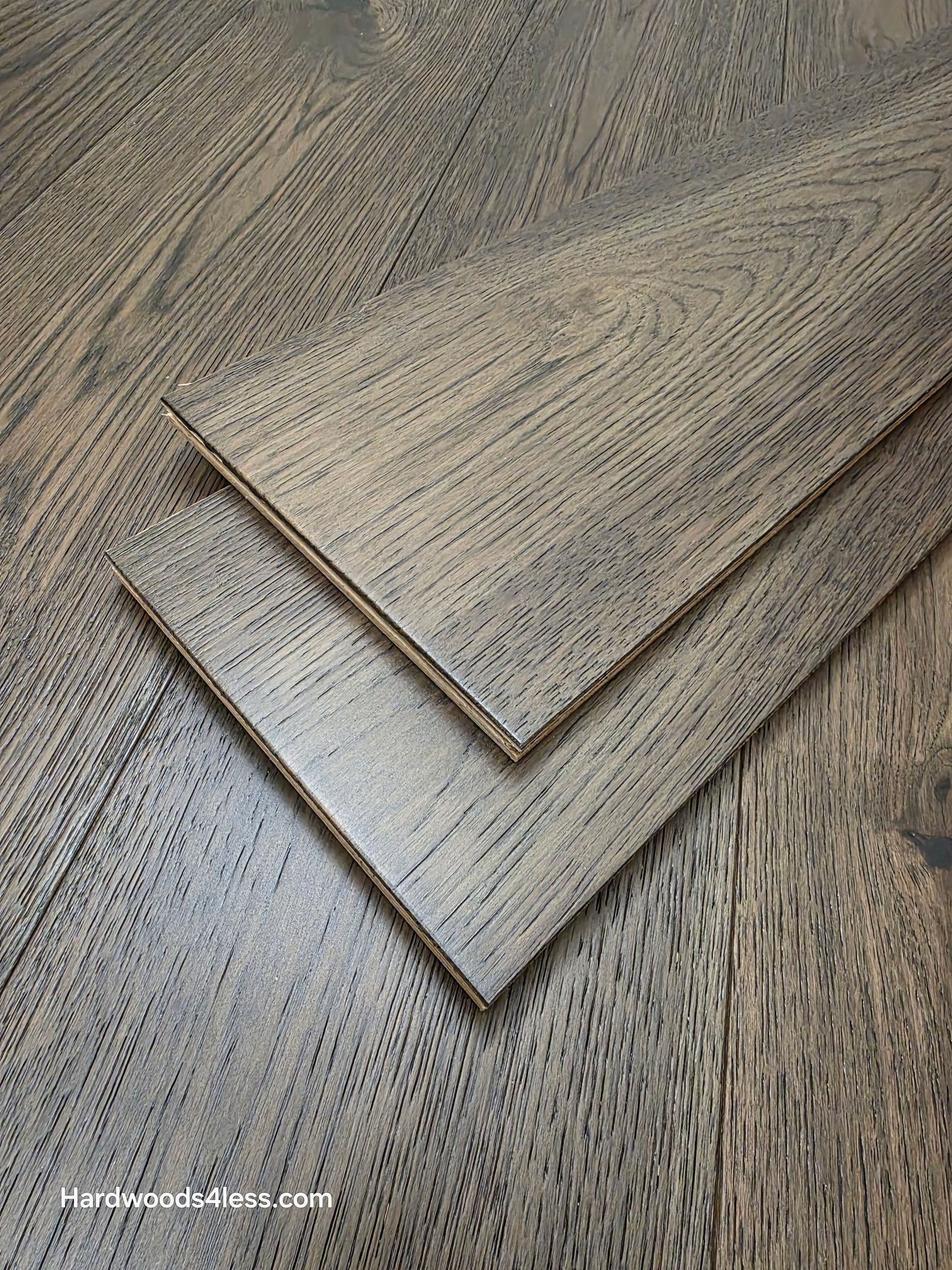 7 1/2" x 9/16" Engineered Hickory Quarry Hardwood Flooring. Shown as two planks stacked on top of the flooring.
