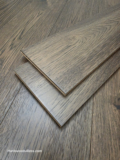 7 1/2" x 9/16" Engineered Hickory Quarry Hardwood Flooring. Shown as two planks stacked on top of the flooring.