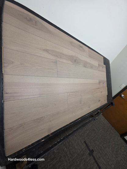 7 3/8" x 1/2" Engineered Hickory Fort Concho Hardwood Flooring. Shown on a black shooting table. shot from steep left. 