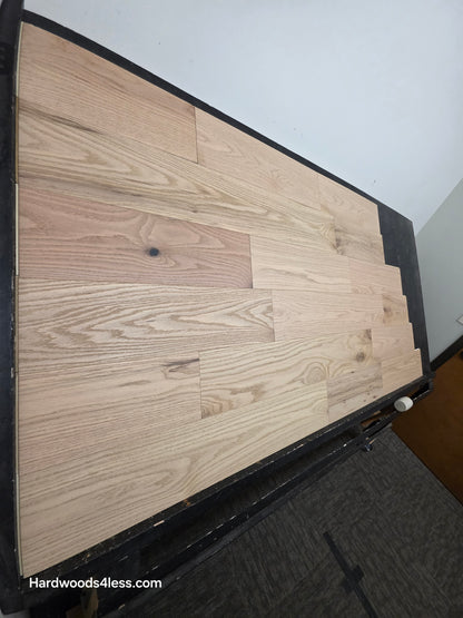 7 3/8" x 1/2" Engineered Red Oak San Bernard Hardwood Flooring. Shown on a black shooting table. Steep left hand shot.
