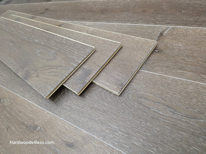 7 3/8" x 1/2" Engineered White Oak Sedona Hardwood Flooring. Shown as three tiles stacked on top of the floor. 