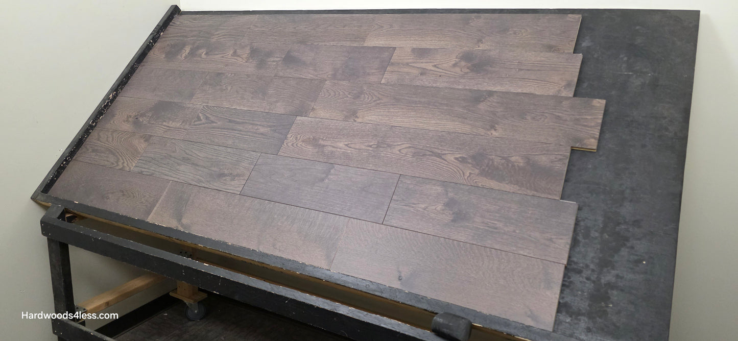 7 3/8" x 5/8" Engineered White Oak Toasted Cocoa Hardwood Flooring. Shown on a black shooting table shot from right side.