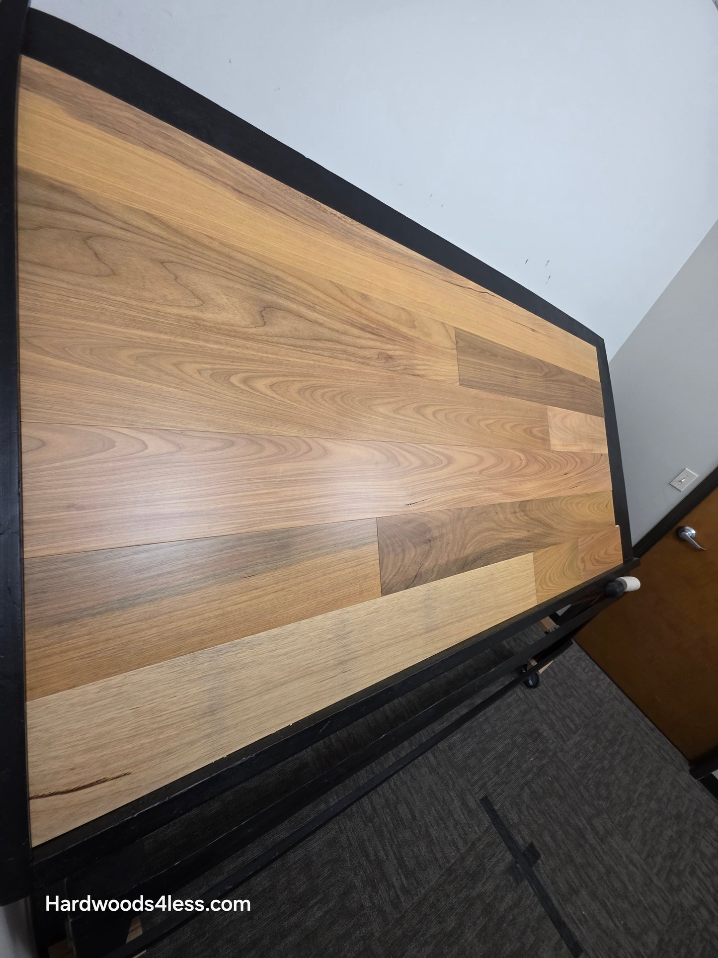 7" x 9/16" Engineered Brazilian Oak Natural Hardwood Flooring. Shown on a black shooting table. Shot from steep left. 