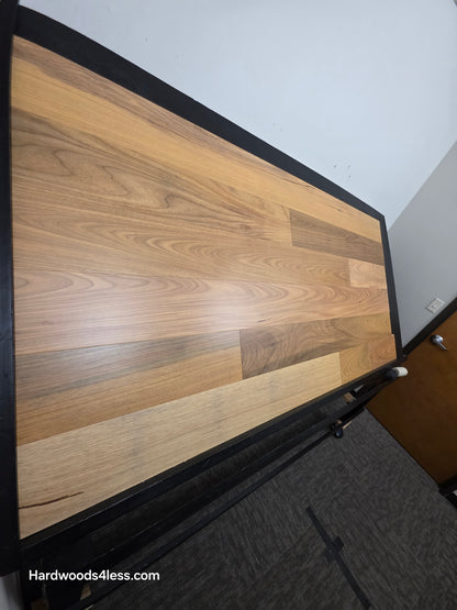 7" x 9/16" Engineered Brazilian Oak Natural Hardwood Flooring. Shown on a black shooting table. Shot from steep left. 