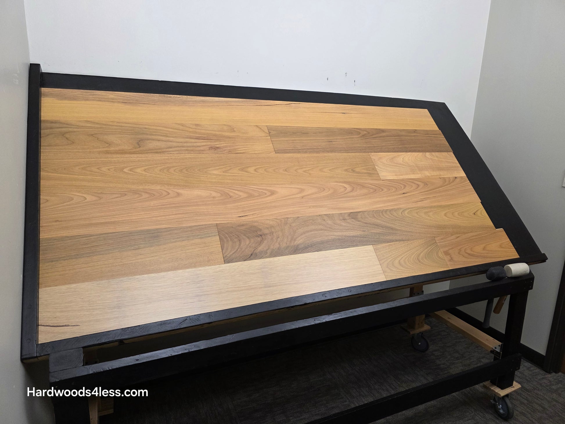 7" x 9/16" Engineered Brazilian Oak Natural Hardwood Flooring. Shown on a black shooting table. Shot from wide left.