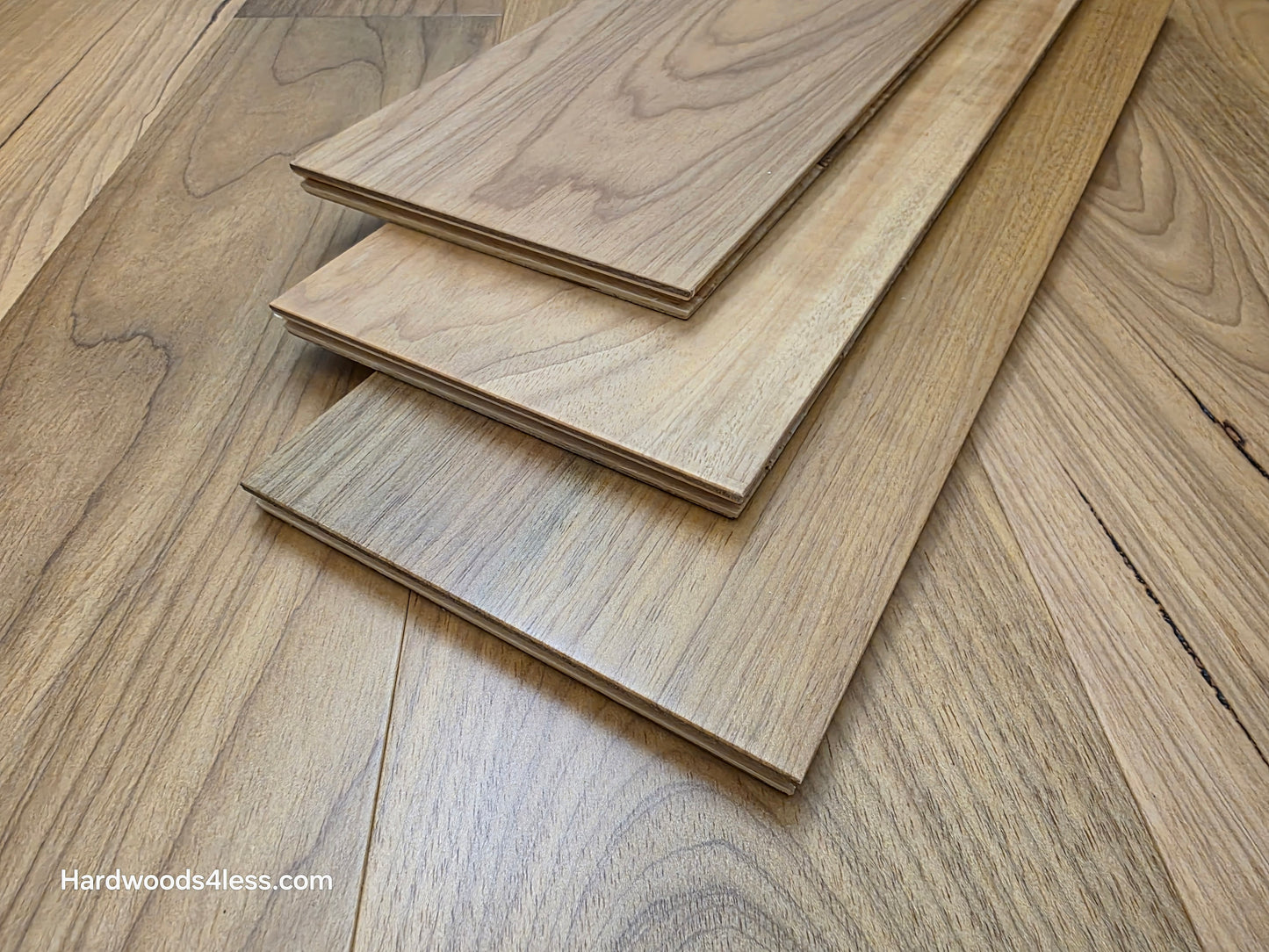 7" x 9/16" Engineered Brazilian Oak Natural Hardwood Flooring. Shown as  3 tiles stacked on top of the floor.