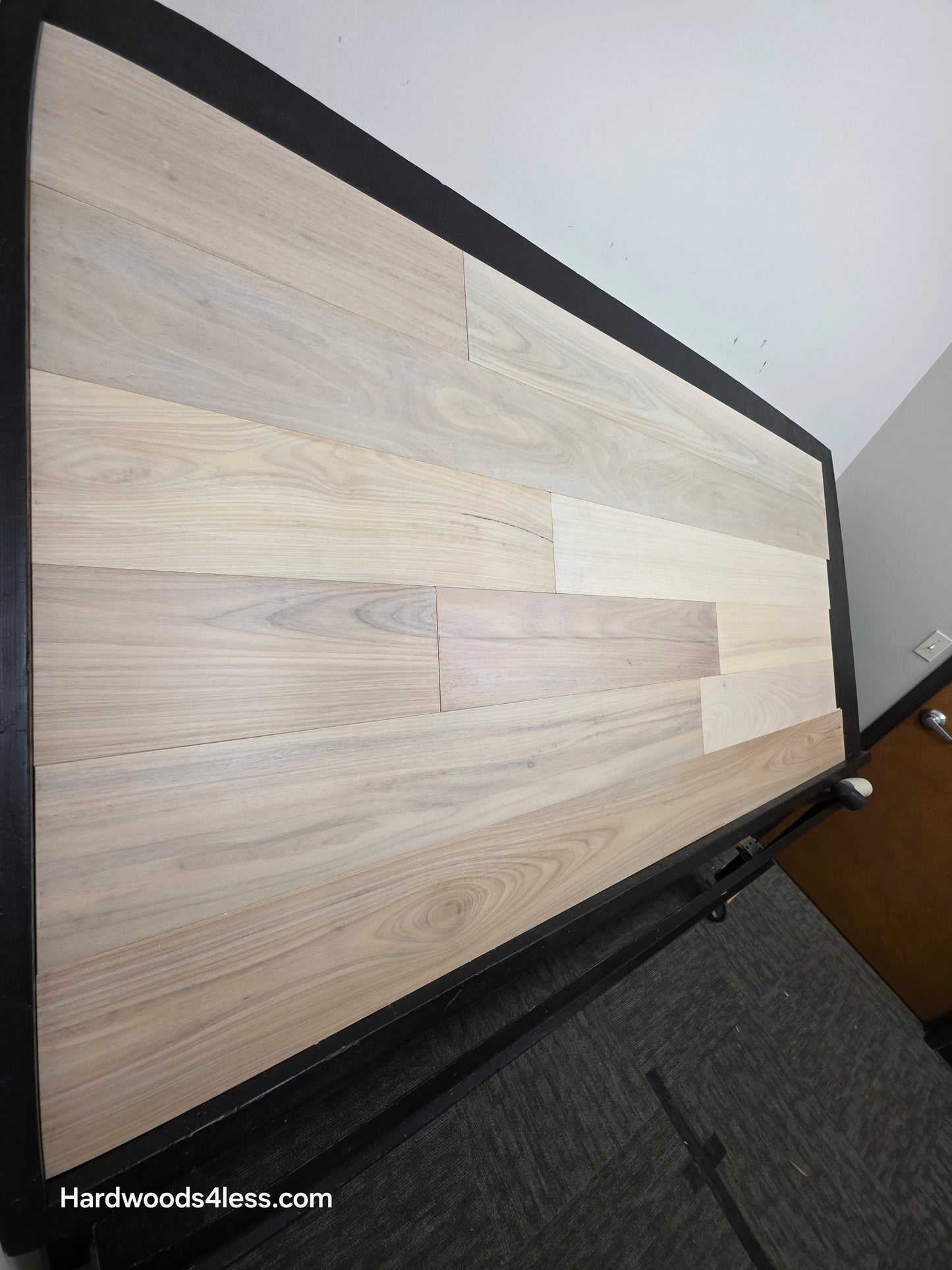 7 x 916 Engineered Brazilian Oak Pearl Hardwood Flooring. Shown on a black shooting table. Shot from steep left.