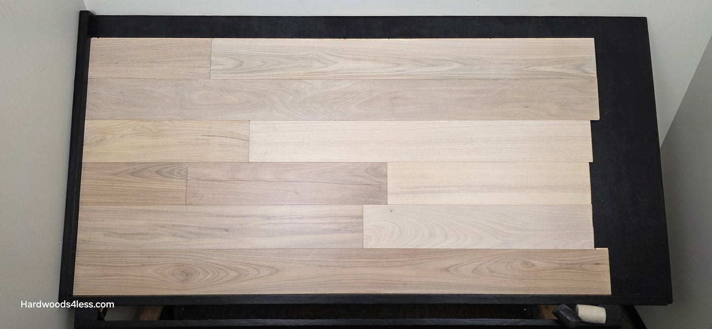 7 x 916 Engineered Brazilian Oak Pearl Hardwood Flooring. Shown on a black shooting table. Shot from Center.