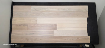 7 x 916 Engineered Brazilian Oak Pearl Hardwood Flooring. Shown on a black shooting table. Shot from Center.