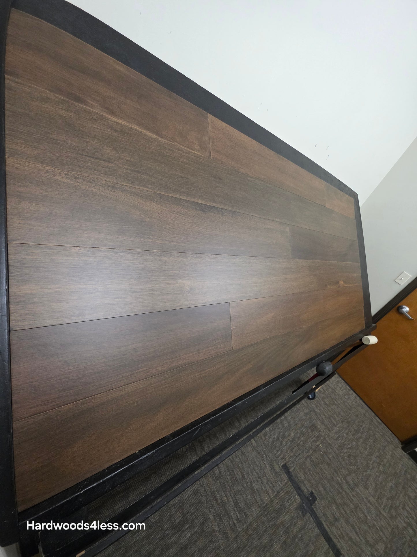 7" x 9/16" Engineered Brazilian Oak Pebble Hardwood Flooring. Shown on a black shooting table. Shot from steep left.