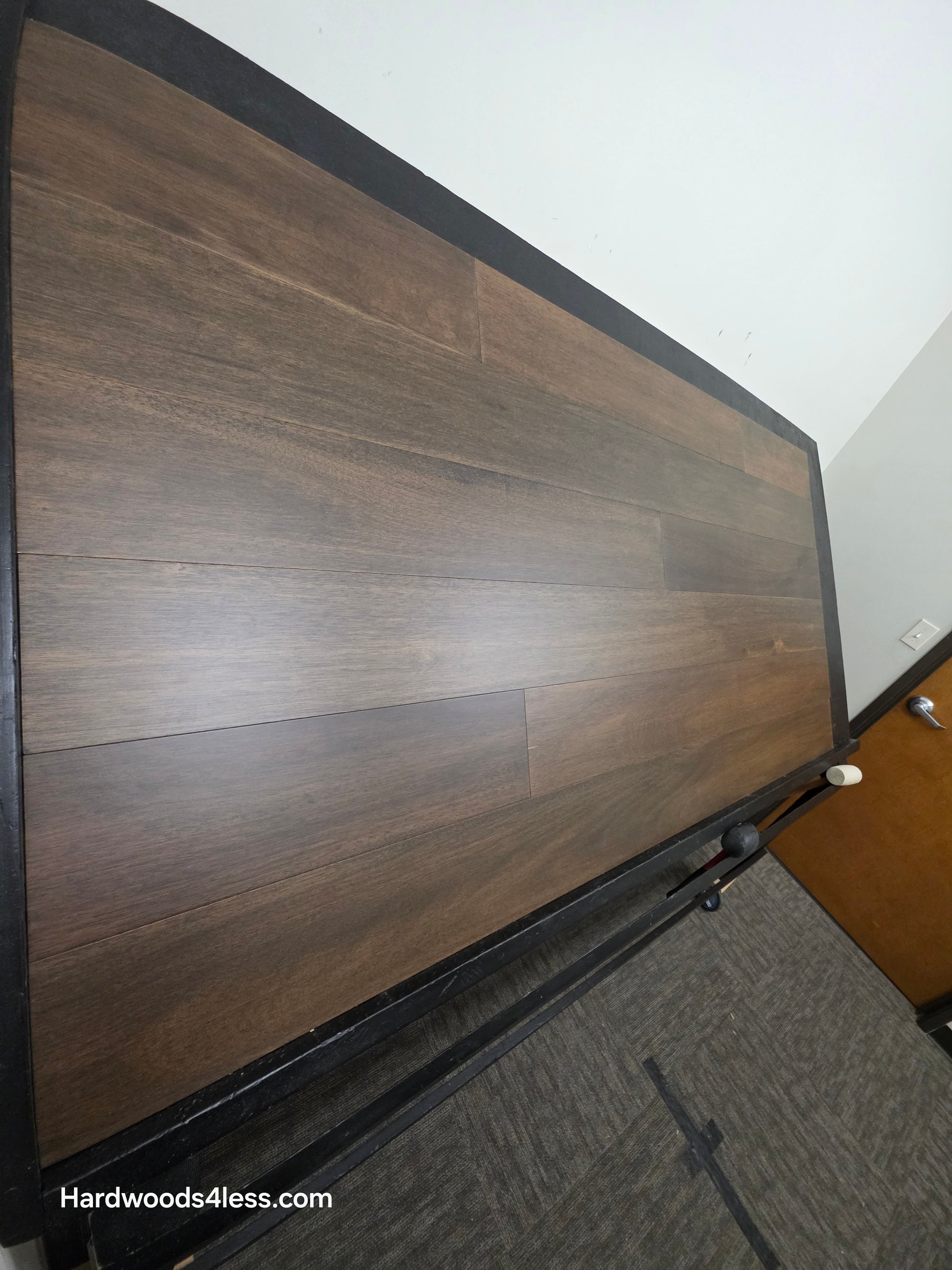 7" x 9/16" Engineered Brazilian Oak Pebble Hardwood Flooring. Shown on a black shooting table. Shot from steep left.