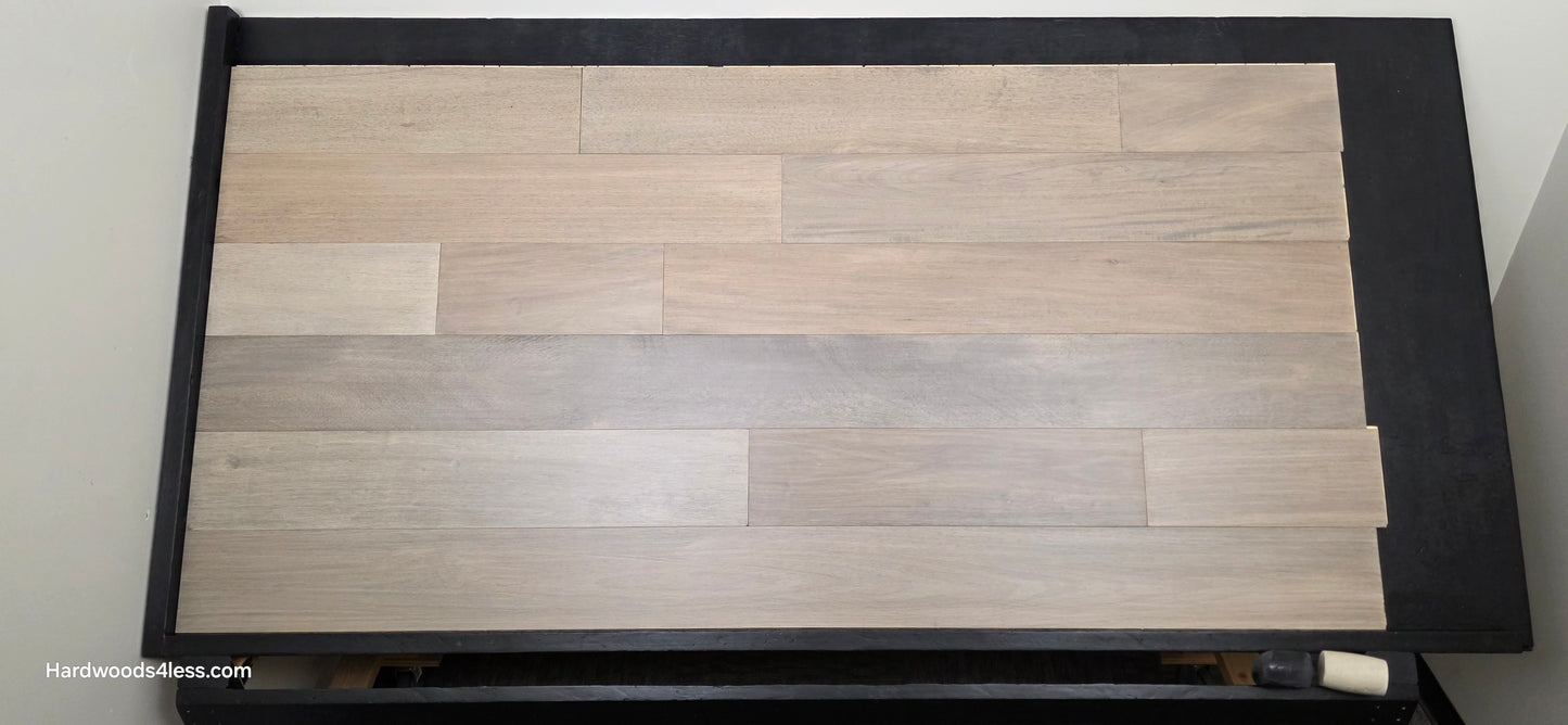 7" x 9/16" Engineered Brazilian Oak Pyrite Hardwood Flooring. Shown on a black shooting table. 