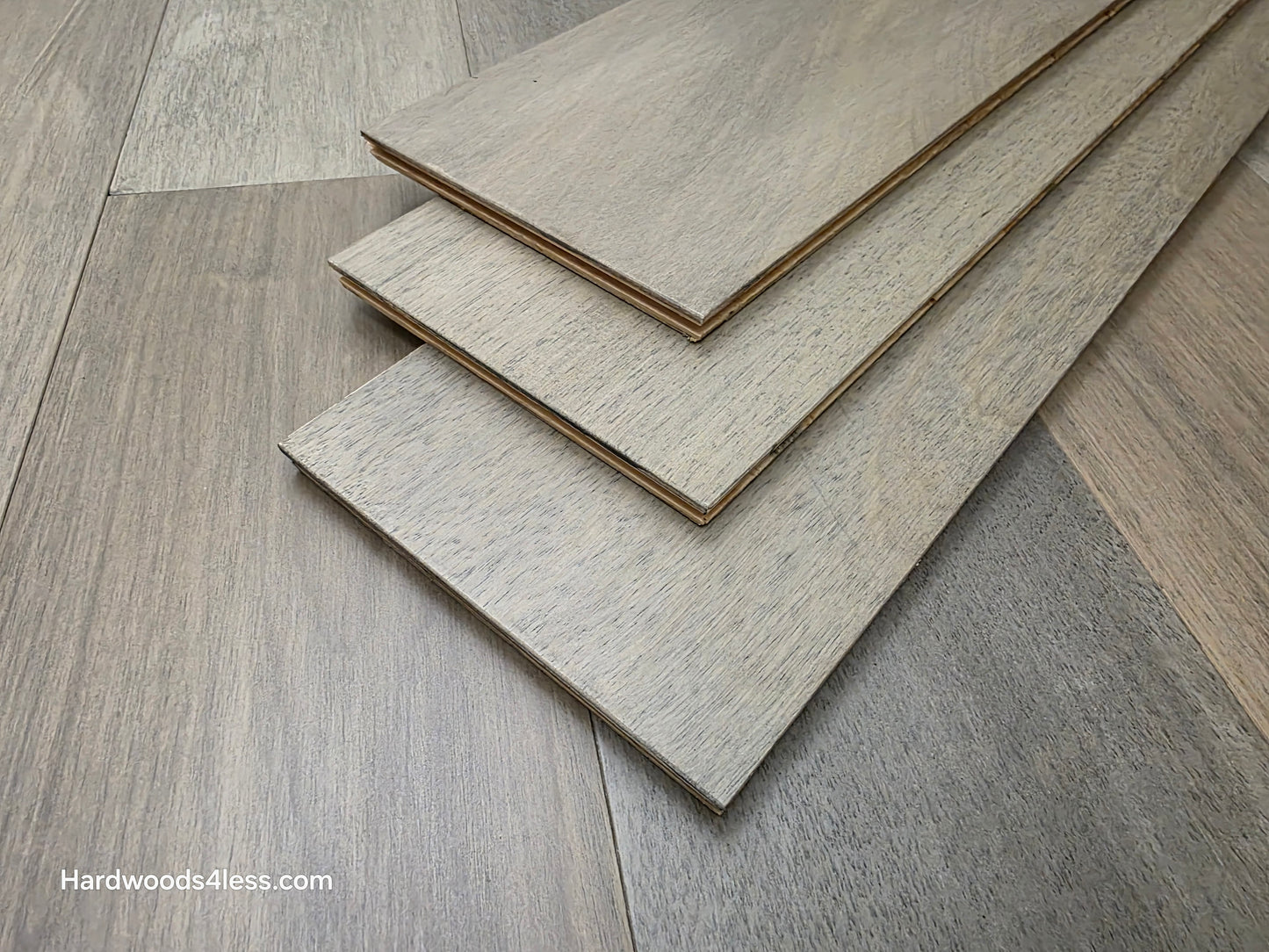 7" x 9/16" Engineered Brazilian Oak Pyrite Hardwood Flooring. Shown as 3 tiles stacked on the floor.