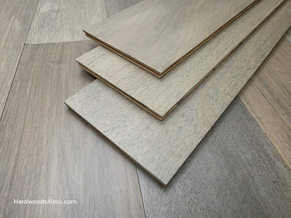 7" x 9/16" Engineered Brazilian Oak Pyrite Hardwood Flooring. Shown as 3 tiles stacked on the floor.