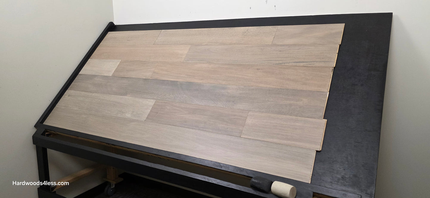 7" x 9/16" Engineered Brazilian Oak Pyrite Hardwood Flooring. Shown on a black shooting table. Shot from wide right.