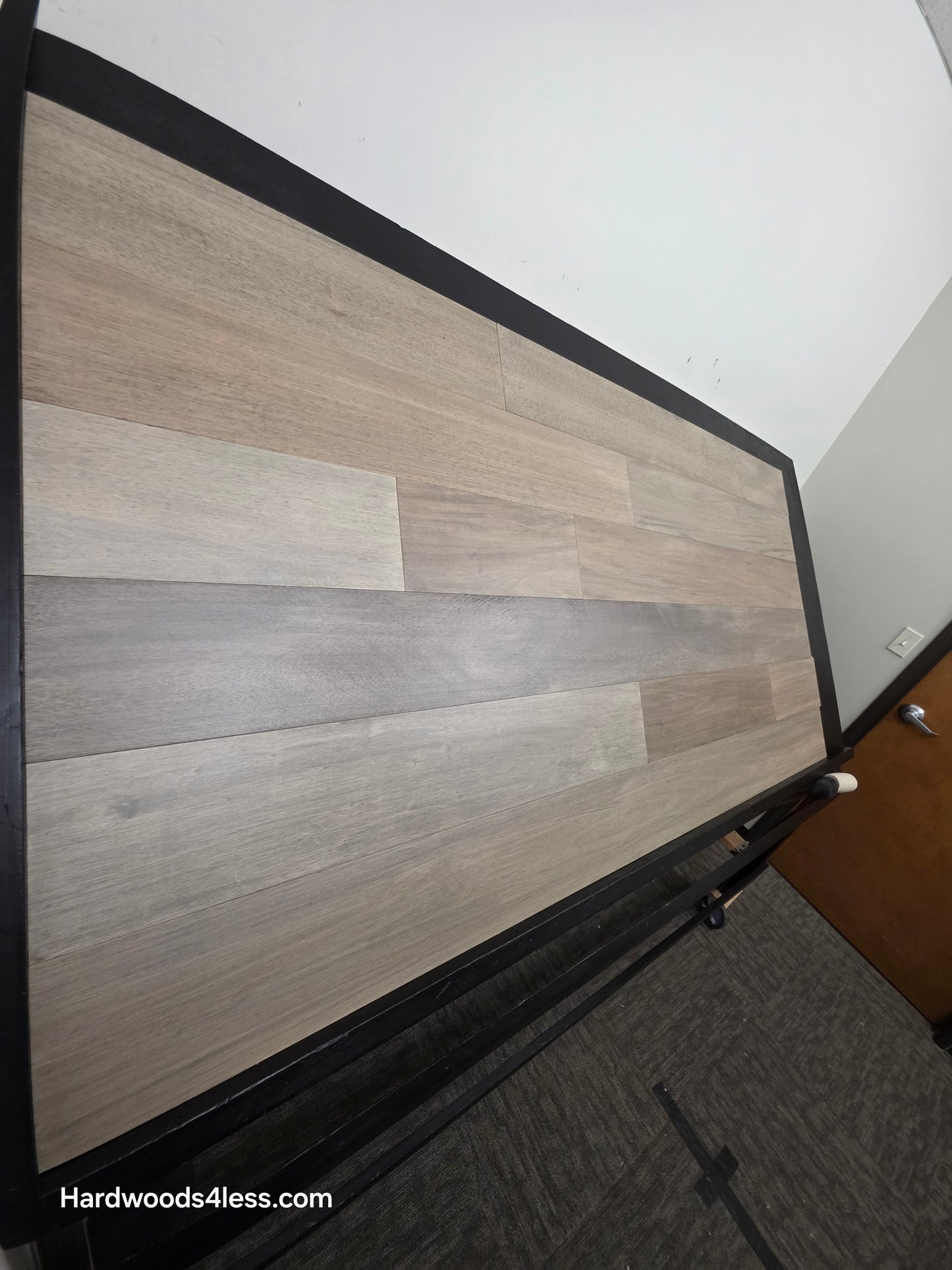 7" x 9/16" Engineered Brazilian Oak Pyrite Hardwood Flooring. Shown on a black shooting table. Shot from tight left.