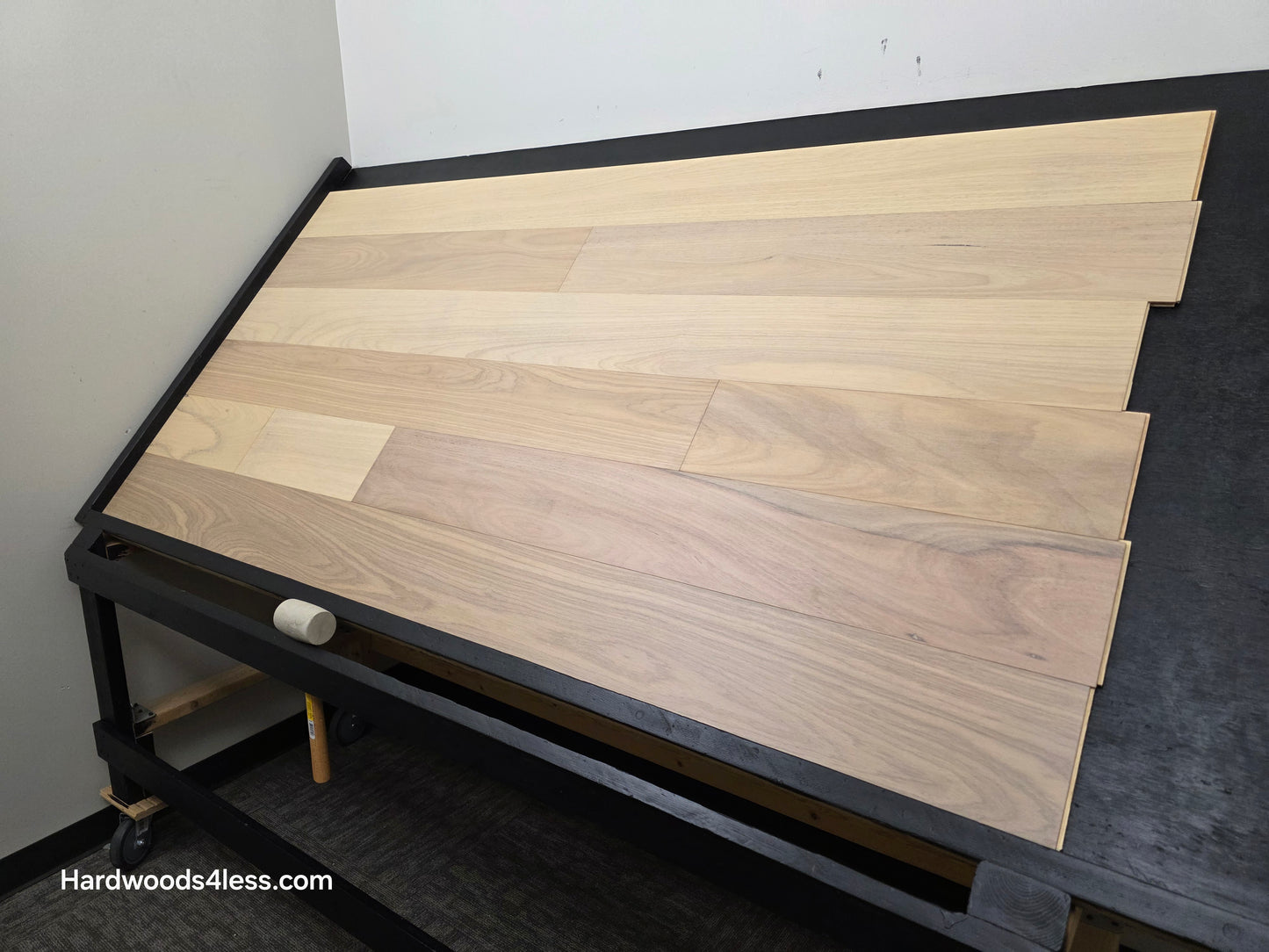 7" x 9/16" Engineered Brazilian Oak Sandy Empire Hardwood Flooring. Shown on a black shooting table. Shot from wide right.