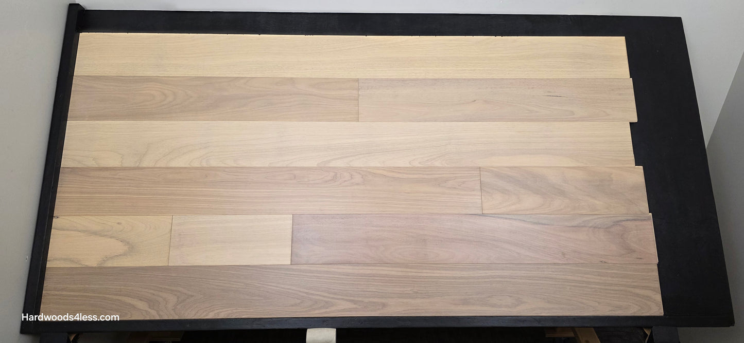 7" x 9/16" Engineered Brazilian Oak Sandy Empire Hardwood Flooring. Shown on a black shooting table. Shot from center.