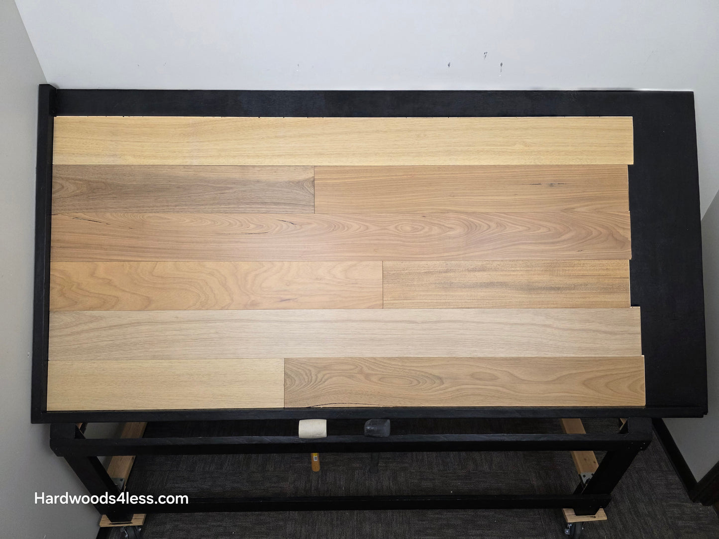 7" x 9/16" Engineered Brazilian Oak Sunlight Hardwood Flooring. Shown on a black shooting table. Shot from center.