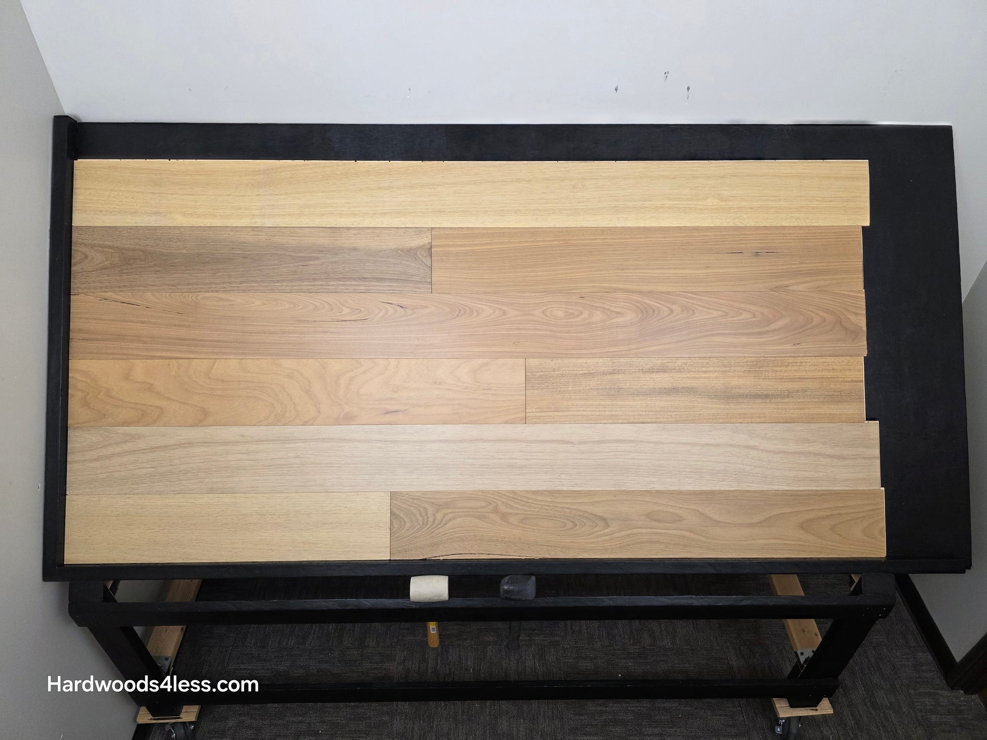 7" x 9/16" Engineered Brazilian Oak Sunlight Hardwood Flooring. Shown on a black shooting table. Shot from center.
