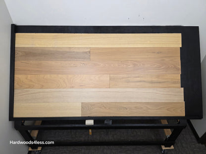 7" x 9/16" Engineered Brazilian Oak Sunlight Hardwood Flooring. Shown on a black shooting table. Shot from center.