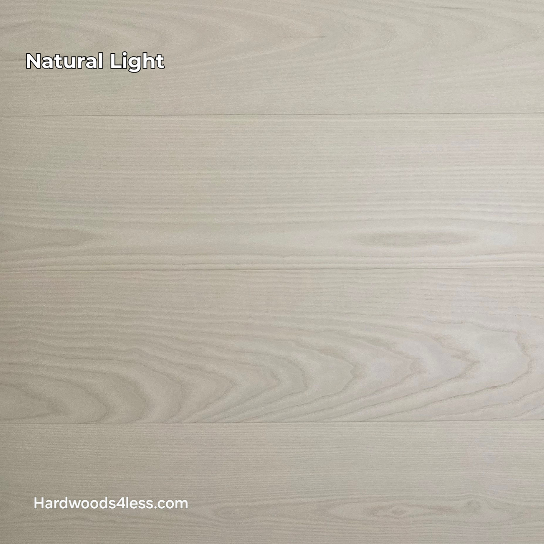 8.11" x 7/16" Modernized Engineered Ash Corbusier Hardened Hardwood Flooring. Shown  in natural lighting.