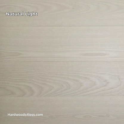 8.11" x 7/16" Modernized Engineered Ash Corbusier Hardened Hardwood Flooring. Shown  in natural lighting.
