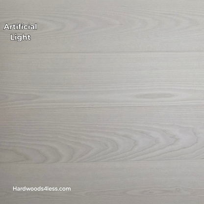 8.11" x 7/16" Modernized Engineered Ash Corbusier Hardened Hardwood Flooring. Shown  in artificial lighting.