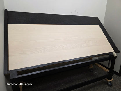 8.11" x 7/16" Modernized Engineered Ash Corbusier Hardened Hardwood Flooring. Shown on a black shooting table. Shot from wide left.
