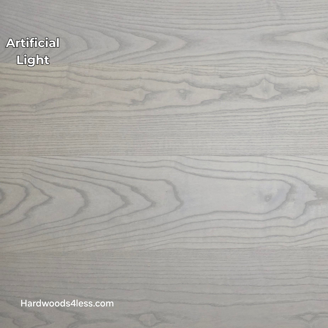 8.11" x 7/16" Modernized Engineered Ash Foster Hardened Hardwood Flooring. Shown in artificial lighting.