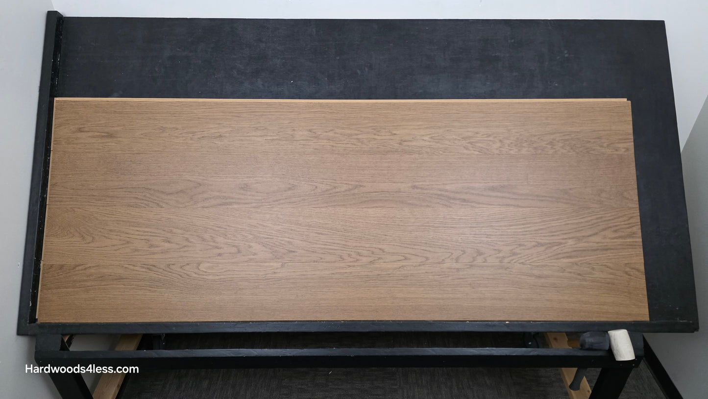8.11" x 7/16" Modernized Engineered European Oak Calatrava Hardened Hardwood Flooring. Shown on a black shooting table. Shot from center. 
