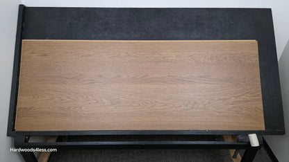 8.11" x 7/16" Modernized Engineered European Oak Calatrava Hardened Hardwood Flooring. Shown on a black shooting table. Shot from center. 