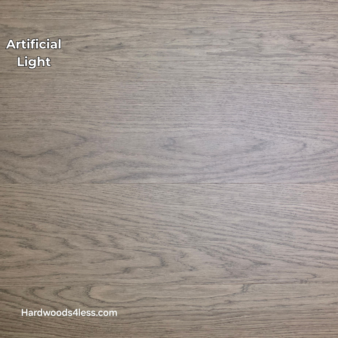 8.11" x 7/16" Modernized Engineered European Oak Calatrava Hardened Hardwood Flooring. Shown in artificial lighting.