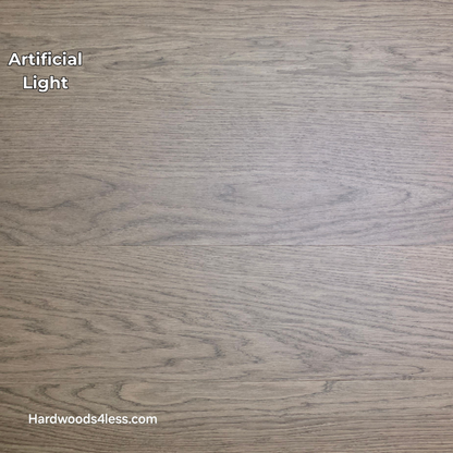 8.11" x 7/16" Modernized Engineered European Oak Calatrava Hardened Hardwood Flooring. Shown in artificial lighting.