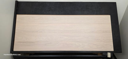8.11 x 716 Modernized Engineered European Oak Corbusier hardened Hardwood Flooring. Shown on a black shooting table. Shot from center.