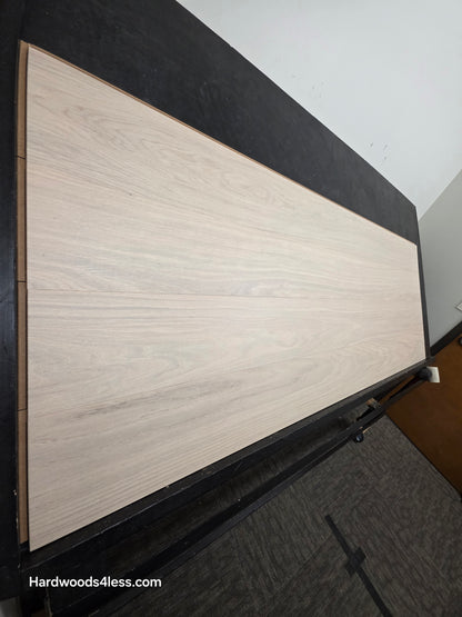 8.11 x 716 Modernized Engineered European Oak Corbusier hardened Hardwood Flooring. Shown on a black shooting table. Shot from steep left.