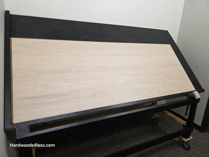 8.11 x 716 Modernized Engineered European Oak Corbusier hardened Hardwood Flooring. Shown on a black shooting table. Shot from wide left.
