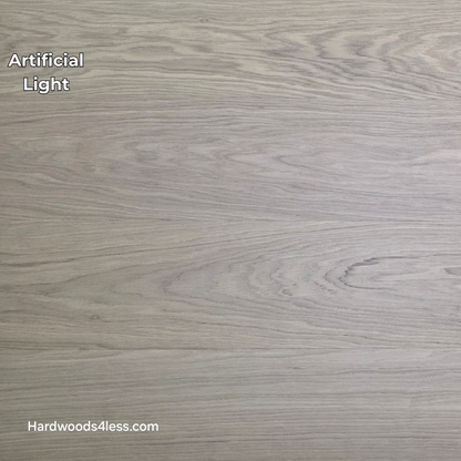 8.11" x 7/16" Modernized Engineered European Oak Gropius Hardened Hardwood Flooring. Shown in artificial lighting.