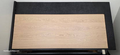 8.11" x 7/16" Modernized Engineered European Oak Gropius Hardened Hardwood Flooring. Shown on a black shooting table. Shot from center.