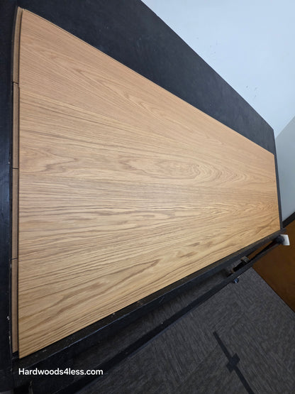 8.11" x 7/16" Modernized Engineered European Oak Hadid Hardened Hardwood Flooring. Shown on a black shooting table. Shot from steep left. 