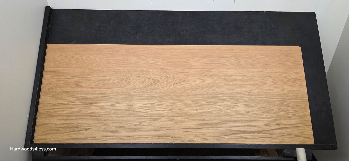 8.11" x 7/16" Modernized Engineered European Oak Hadid Hardened Hardwood Flooring. Shown on a black shooting table. Shot from center.