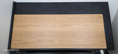 8.11" x 7/16" Modernized Engineered European Oak Wright Hardened Hardwood Flooring. Shown on a black shooting table. Shot from center.