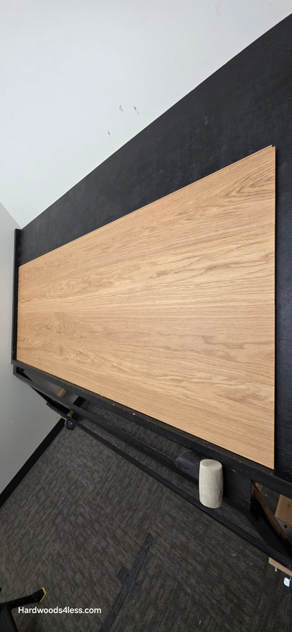 8.11" x 7/16" Modernized Engineered European Oak Wright Hardened Hardwood Flooring. Shown on a black shooting table. Shot from steep right.