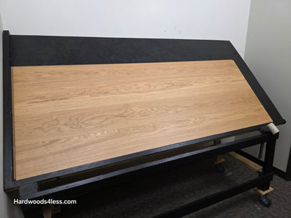 8.11" x 7/16" Modernized Engineered European Oak Wright Hardened Hardwood Flooring. Shown on a black shooting table. Shot from wide left.