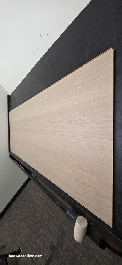 8.11" x 7/16" Modernized Engineered European Oak Foster Hardened Hardwood Flooring. Shown on a black shooting table. Shot from steep right.